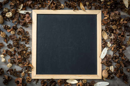 Blackboard and autumn leavesの写真素材