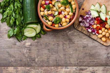 Chickpea salad on wooden backgroundの写真素材