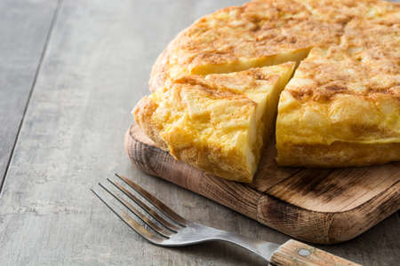 Traditional spanish omelette on wooden tableの写真素材