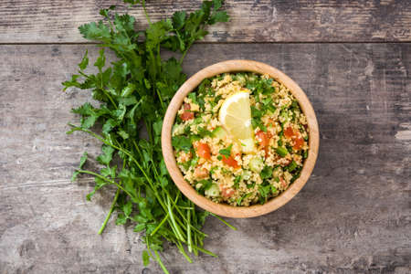 Tabbouleh salad with couscous on rustic tableの写真素材