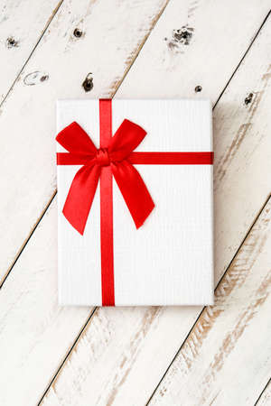 White gift box on white wooden backgroundの写真素材