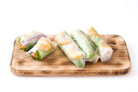Vietnamese rolls with vegetables, rice noodles and prawns isolated on white background
