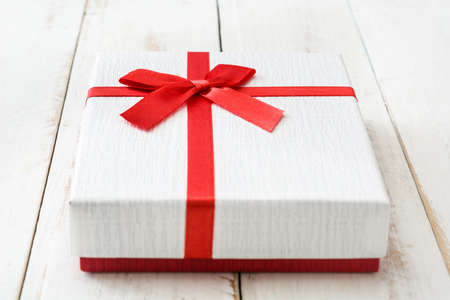 White gift box on white wooden table.closeupの写真素材