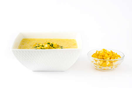 Corn soup in white bowl isolated on white background