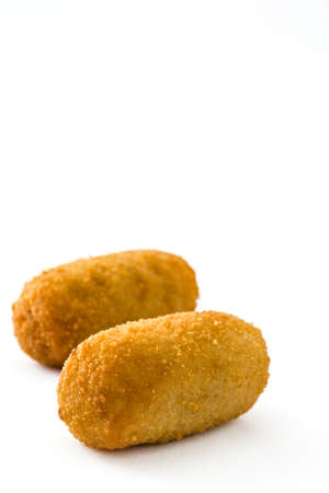Traditional Spanish fried croquetas (croquettes) isolated on white backgroundの写真素材