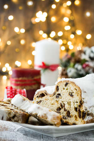 Christmas stollen. Traditional German Christmas dessert on wooden backgroundの写真素材