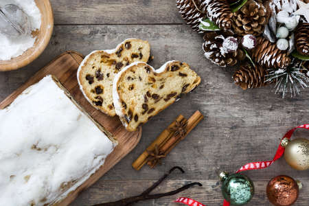 Christmas stollen. Traditional German Christmas dessert on wooden backgroundの写真素材