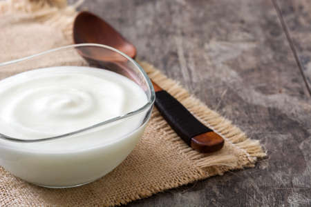 Greek yogurt on wooden table