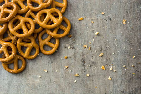 Salted pretzels on wooden backgroundの写真素材