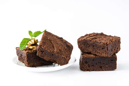 Chocolate brownie pieces isolated on white backgroundの写真素材
