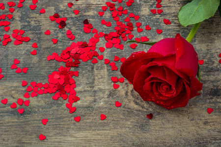 Red rose on wooden background.Love valentines day concept. Copyspace.の写真素材