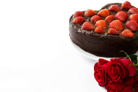 Heart shaped cake and roses for Valentine's Day or Mother's Day isolated on white backgroundの写真素材