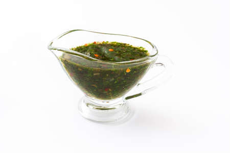Green Chimichurri Sauce on isolated on white backgroundの写真素材