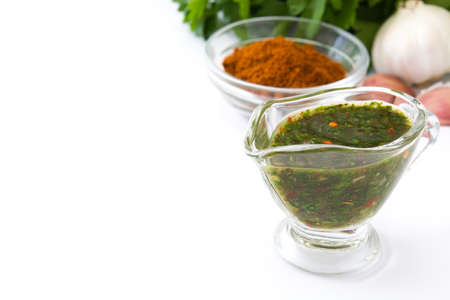 Green Chimichurri Sauce and ingredients on isolated on white backgroundの写真素材