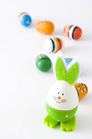 Easter eggs and rabbit isolated on white background. Copyspace.