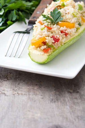 With stuffed zucchini quinoa and vegetables on wooden backgroundの写真素材