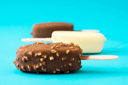 Chocolate ice cream  isolated on blue background.