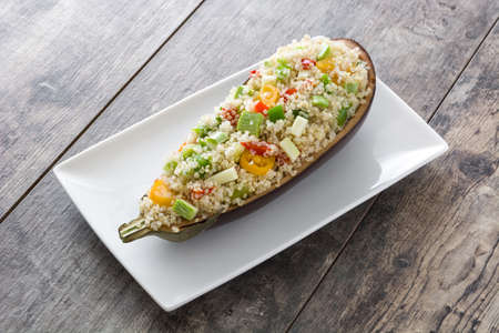 With Quinoa Stuffed eggplant and vegetables on wooden backgroundの写真素材