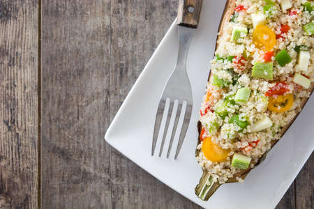 With Quinoa Stuffed eggplant and vegetables on wooden backgroundの写真素材