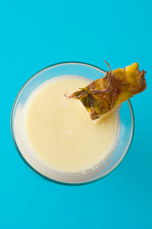 Pina colada cocktail on blue backgroundの写真素材