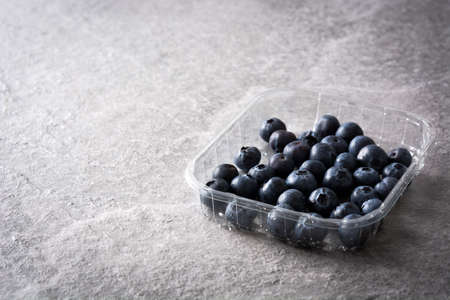 Blueberries on gray stoneの写真素材