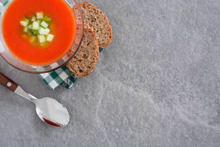 Traditional Spanish cold gazpacho soup on gray stone.Top viewの写真素材