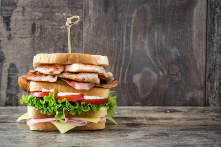 Club sandwich on wooden table backgroundの写真素材