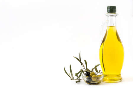 Virgin olive oil in a crystal bottle isolated on white background. copyspace