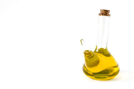 Virgin olive oil in a crystal bottle isolated on white background.copyspaceの写真素材
