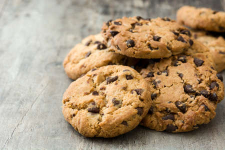 Chocolate chip cookies on wooden table background