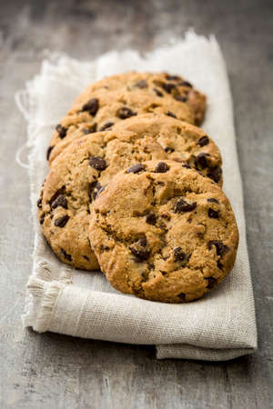 Chocolate chip cookies on wooden table background