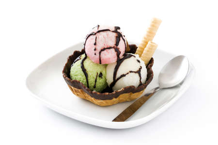 Ice cream scoops served in waffle basket isolated on white background