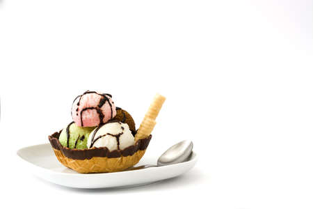 Ice cream scoops served in waffle basket isolated on white background