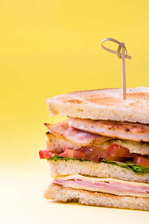 Club sandwich on yellow backgroundの写真素材