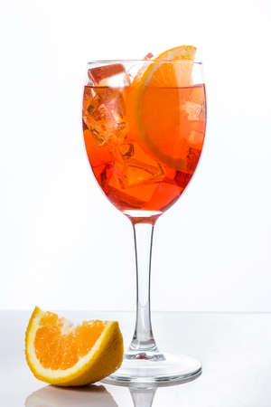Aperol spritz cocktail in glass isolated on white backgroundの写真素材