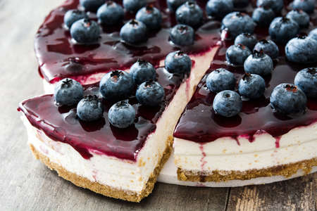 Blueberry cheesecake on wooden tableの写真素材