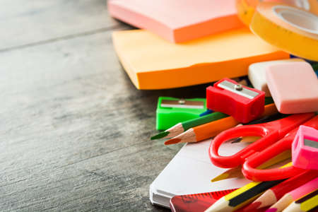 School supplies on wooden background. Back to school concept. Copyspace.