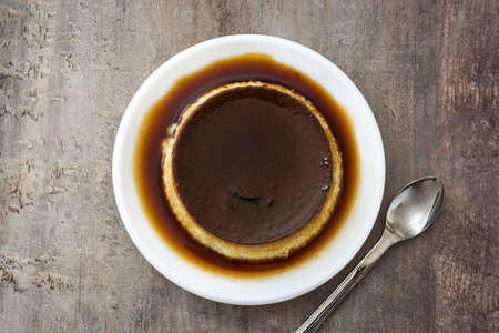Creme caramel. Egg pudding on wooden table.Copy space