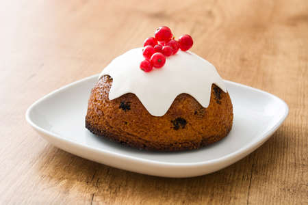 Christmas pudding on wooden tableの写真素材