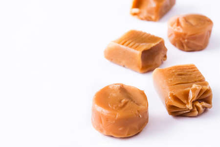 Toffee caramel candies isolated on white background. Copyspace.の写真素材