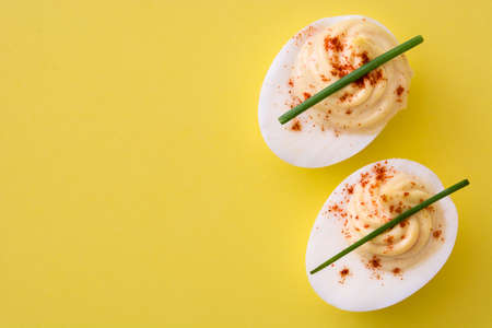 Classic stuffed egg on yellow backgroundの写真素材