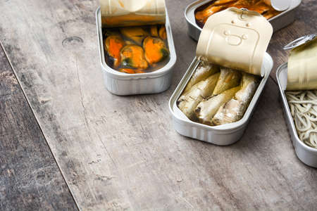 Cans of preserves on wooden table. Copyspaceの写真素材