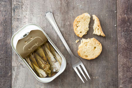 Sardines can preserve on wooden table. Top viewの写真素材