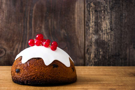 Christmas pudding on wooden tableの写真素材