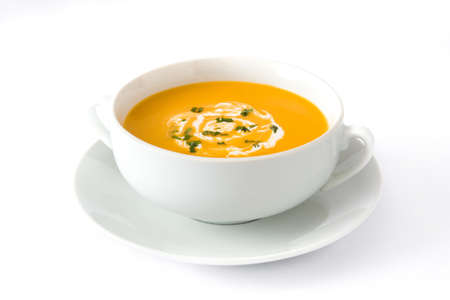 Pumpkin soup in white bowl isolated on white backgroundの写真素材