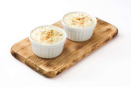 Rice pudding. Rice pudding with cinnamon isolated on white backgroundの写真素材