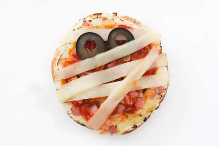 Halloween pumkins mini mummies isolated on white backgroundの写真素材