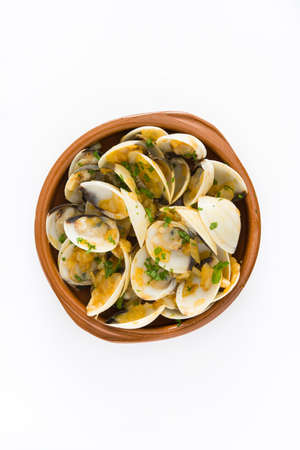 Clams with marinera sauce. Clams to the marinera. Spanish recipe isolated on white background.Top viewの写真素材