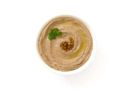 Lentil hummus in bowl isolated on white background. Top viewの写真素材