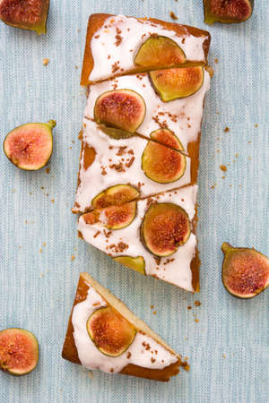 Delicious fig cake on blue background.Top viewの写真素材